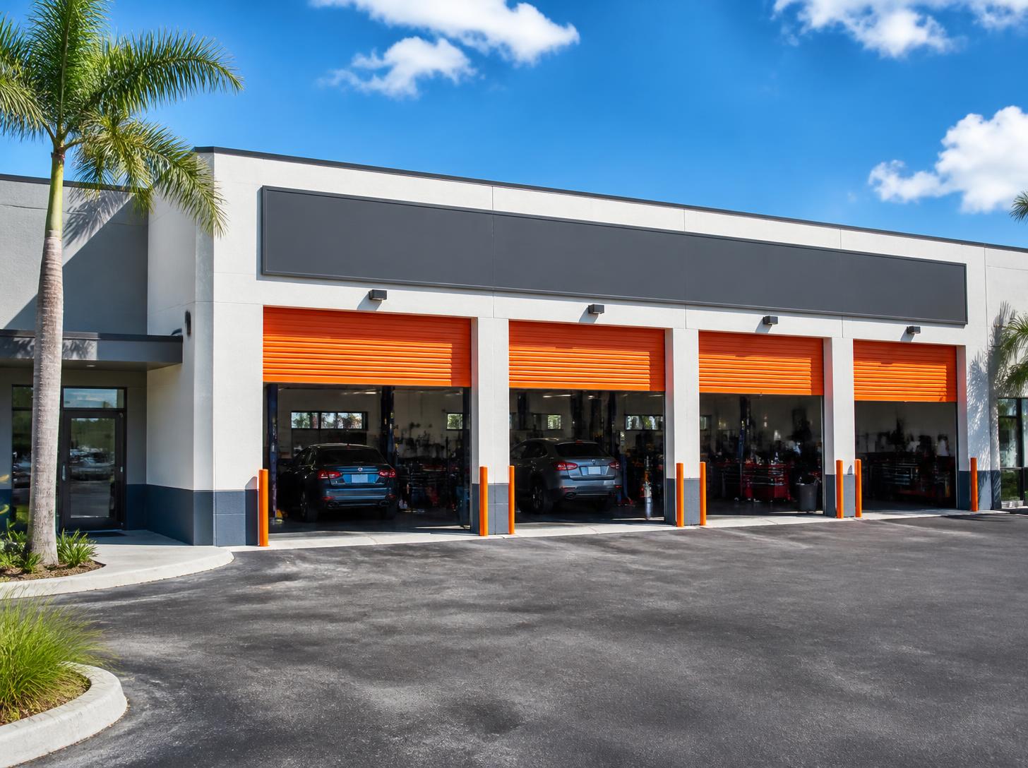 Brightwrench Auto Care shop with orange bay doors